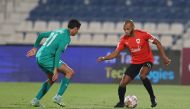 Al Rayyan’s Yacine Brahimi (right) in action during the Ooredoo Cup match against Al Ahli, yesterday.