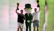 Winners of InterContinental’s 75th Anniversary Golf Open pose for a photo with Mr. Monopoly, at the Doha Golf Club, recently. 