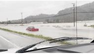 A car is submerged after rainstorms lashed the western Canadian province of British Columbia, triggering landslides and floods, shutting highways, in Abbotsford, British Columbia, Canada November 28, 2021, in this still image obtained from social media video on November 29, 2021. Courtesy of Twitter/@pnaught13/via REUTERS