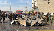 Iraqi security forces inspect the site of an explosion in Basra,Iraq December 7, 2021. Reuters/Mohammed Aty