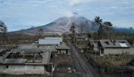 A local collects usable goods from her damaged house, at an area affected by the eruption of Mount Semeru volcano, in Curah Kobokan, Pronojiwo district, Lumajang, Indonesia, December 7, 2021. Picture taken with a drone. REUTERS/Willy Kurniawan TPX IMAGES OF THE DAY
