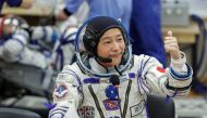 Japanese entrepreneur Yusaku Maezawa reacts as he speaks with his family after donning space suits shortly before the launch to the International Space Station (ISS) at the Baikonur Cosmodrome, Kazakhstan, December 8, 2021. REUTERS/Shamil Zhumatov