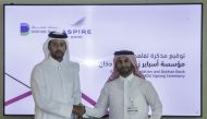 Aspire Zone Foundation Mohammed Khalifa Al Suwaidi and CEO of Dukhan Bank, Khalid Yousef Al Subeai exchanging document after signing the agreement.