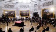 U.S. President Joe Biden speaks near the casket of former U.S. Senator Bob Dole during a ceremony preceding his lying in state in the Rotunda of the U.S. Capitol in Washington, D.C., U.S., December 9, 2021. Shawn Thew/Pool via REUTERS
