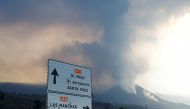 The Cumbre Vieja volcano continues to expel lava and ash, as seen from Tajuya on the Canary Island of La Palma, Spain, December 13, 2021. REUTERS/Borja Suarez
