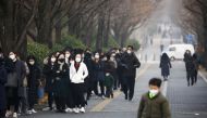 People wait in a long line to undergo coronavirus disease (COVID-19) test at a testing site in Seoul, South Korea, December 15, 2021. REUTERS/Kim Hong-Ji