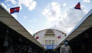 A guard walks past empty stalls at Central Market, during the coronavirus disease (COVID-19) outbreak, in Phnom Penh, Cambodia, August 12, 2021. REUTERS/Cindy Liu

