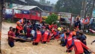 Philippine Coast Guard personnel rescue residents after being inundated by floods caused by Typhoon Rai in Cagayan De Oro City, Philippines, December 16, 2021. Philippine Coast Guard/Handout via REUTERS