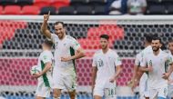Algeria’s Djamel Benlamri celebrates after scoring against Sudan in their opening match of the FIFA Arab Cup Qatar 2021.