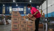 A worker prepares relief goods for people affected by typhoon Rai, at a government warehouse in Pasay City, Metro Manila, Philippines, December 17, 2021. Reuters/Lisa Marie David