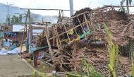 Houses damaged by typhoon Rai are seen, in Surigao del Norte province, Philippines, December 18, 2021. Philippine Coast Guard/Handout via Reuters 