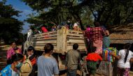Refugees as they are voluntarily returning across the border to Myanmar, at a pier in Mae Sot district, Tak province, Thailand, December 19, 2021. Reuters/Athit Perawongmetha