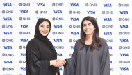 Heba Al Tamimi (left), GM Group Retail Banking at QNB with a Visa official in Doha, recently. 
