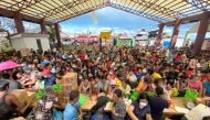 People affected by the typhoon Rai gather during a distribution of relief goods, in Surigao City, Surigao del Norte, Philippines, December 20, 2021. Picture taken December 20, 2021. Erwin Mascarinas/Greenpeace/Handout via REUTERS