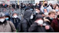 People queue to get vaccinated against the coronavirus disease (COVID-19) during the annual Christmas campaign of German musician Frank Zander to homeless and people in need, in Berlin, Germany, December 14, 2021. REUTERS/Hannibal Hanschke


