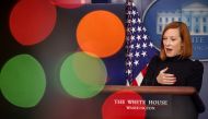 Press Secretary Jen Psaki is seen through Christmas lights during a media briefing at the White House in Washington, U.S., December 23, 2021. REUTERS/Evelyn Hockstein
