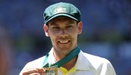 Australia's Scott Boland celebrates with the Mullagh Medal after winning the match and retaining the Ashes. Reuters/Loren Elliott