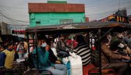 People are seen at a crowded market amidst the spread of the coronavirus disease (COVID-19), in the old quarters of Delhi, India, January 4, 2022. REUTERS/Adnan Abidi