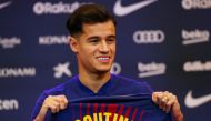 FILE PHOTO: Soccer Football - FC Barcelona - Philippe Coutinho News Conference - Auditorium 1899, Barcelona, Spain - January 8, 2018 FC Barcelona's new signing Philippe Coutinho poses with the club shirt REUTERS/Albert Gea/File Photo
