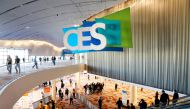 Attendees pass by a CES sign during CES 2022 in Las Vegas, Nevada, U.S. January 6, 2022. REUTERS/Steve Marcus/File Photo
