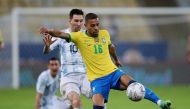 Argentina's Lionel Messi in action with Brazil's Renan Lodi REUTERS/Ricardo Moraes/File Photo