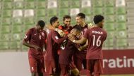 Al Markhiya players celebrate after defeating Mesaimeer SC.