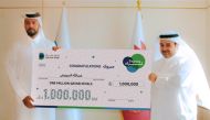 Dukhan Bank customer Abdulla Al Darwish receiving the grand prize.  