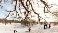 Children sled at Waveland Golf Course after the area accumulated snow from Winter Storm Izzy in Des Moines, Iowa, U.S., January 15, 2022. REUTERS/Rachel Mummey
