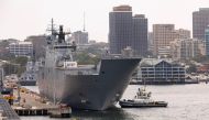HMAS Adelaide departs Fleet Base East at Garden Island, Sydney, Australia, for Brisbane in preparation to provide disaster relief and assistance to Tonga, January 17, 2022. Australian Department of Defence/Handout via Reuters