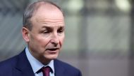Ireland's Prime Minister (Taoiseach) Micheal Martin looks on as he arrives to attend an European Union Summit at the European Council building in Brussels, Belgium December 16, 2021. Kenzo Tribouillard/Pool via REUTERS/File Photo