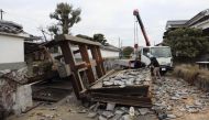 A collapsed gate to the residential house caused by an earthquake is seen in Oita, southern Japan January 22, 2022, in this photo taken by Kyodo. Kyodo/via Reuters