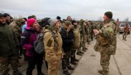 Reservists of the Ukrainian Territorial Defence Forces listen to instructions during military exercises at a training ground outside Kharkiv, Ukraine December 11, 2021. Reuters/Vyacheslav Madiyevskyy/File Photo