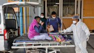 A man with breathing problem is wheeled inside a COVID-19 hospital for treatment during the ongoing coronavirus disease (COVID-19) in Ahmedabad, India, January 24, 2022. REUTERS/Amit Dave