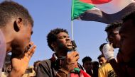 People attend a march during a protest against military rule following last month's coup in Khartoum, Sudan, January 24, 2022. REUTERS.