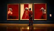 A staff member from the Royal Academy of Arts poses with 