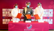 QFA Secretary-General Mansour Al Ansari, Executive Director of Sales, Marketing and Communication at QSL, Hassan Rabia Al Kuwari, and Qilaa Consulting CEO Sheikh Jassim bin Abdulaziz Al Thani pose for a photograph after signing the partnership agreement, yesterday.