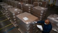 FILE PHOTO: A Pfizer employee checks the boxes containing Paxlovid, COVID-19 treatment pills, at a distribution facility in Memphis, Tennessee, U.S.
