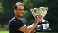 January 31, 2022 Spain's Rafael Nadal poses with the Norman Brookes Challenge Cup trophy after winning the Australian Open Joel Carrett/AAP Image via REUTERS
