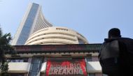 A man looks at a screen displaying budget news, on a facade of the Bombay Stock Exchange (BSE) building in Mumbai, India, February 1, 2022. Reuters/Francis Mascarenhas