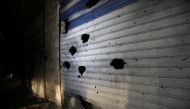 A damaged shutter is seen on a building in the aftermath of a counter-terrorism mission conducted by the U.S. Special Operations Forces in Atmeh, Syria, February 3, 2022 in this picture obtained from social media. Courtesy of Mohamed Al-Daher/via Reuters 