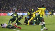 Senegal players celebrate winning the penalty shoot out REUTERS/Mohamed Abd El Ghany
