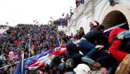 FILE PHOTO: Pro-Trump protesters storm into the U.S. Capitol during clashes with police, during a rally to contest the certification of the 2020 U.S. presidential election results by the U.S. Congress, in Washington, U.S, January 6, 2021. REUTERS/Shannon Stapleton/File Photo


