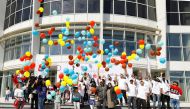 The Commercial Avenue celebrating the NSD activities by releasing colourful balloons.