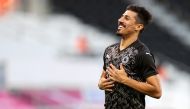 Baghdad Bounedjah celebrates after scoring Al Sadd's first goal against Umm Salal.