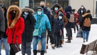 People queue to collect coronavirus disease (COVID-19) antigen test kits at the Rideau Centre mall in Ottawa, Ontario, Canada January 7, 2022. REUTERS/Patrick Doyle


