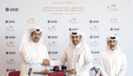 Qatar Racing and Equestrian Club Chairman Issa bin Mohammed Al Mohannadi and Salem Al Naimi, Assistant General Manager of QNB Public Relations shake hands during the sponsorship signing ceremony.   
