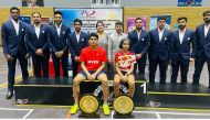 Sponsorship winners Nishant Devendraraj Shenai and Mayukha Sreejesh pose for a photo with the NVBS coaches. 