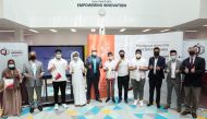 Qatargas officials with students who attended the workshop.