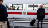 People wait for a train to arrive at the DB Berlin Hauptbahnhof or Berlin main train station in Berlin, Germany September 2, 2021. REUTERS/Michele Tantussi/File Photo