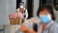 International passengers arrive at Melbourne Airport, after Australia reopened its international borders to travelers vaccinated against the coronavirus disease (COVID-19), in Melbourne, Australia February 21, 2022. AAP Image/Joel Carrett via REUTERS